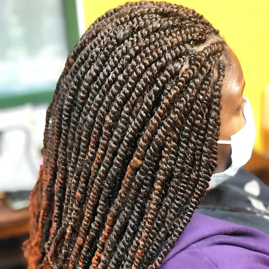 Close-up of woman with spring twists hairstyle.
